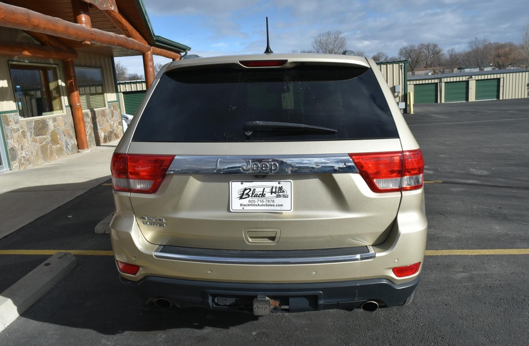 2011 Gold /Tan Jeep Grand Cherokee Limited (1J4RR5GT9BC) with an 5.7L HEMI V-8 engine, 5-Speed Automatic transmission, located at 1600 E Hwy 44, Rapid City, SD, 57703, (605) 716-7878, 44.070232, -103.171410 - Photo #6